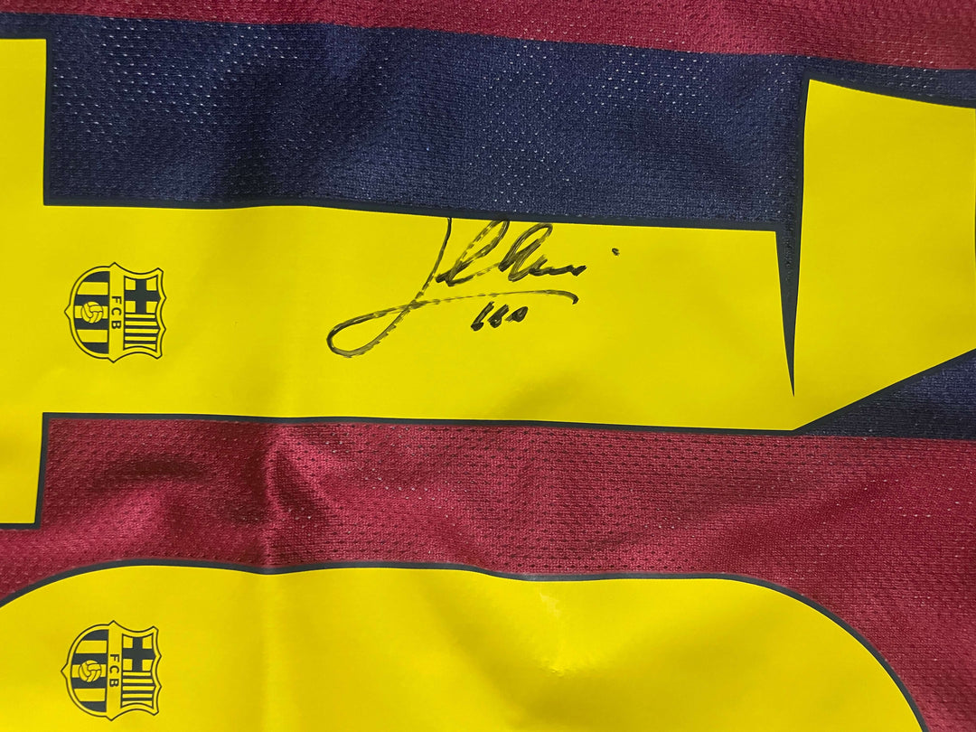 Lionel Messi signature on 2015 Champions League final jersey, showcasing authenticity and iconic football heritage.