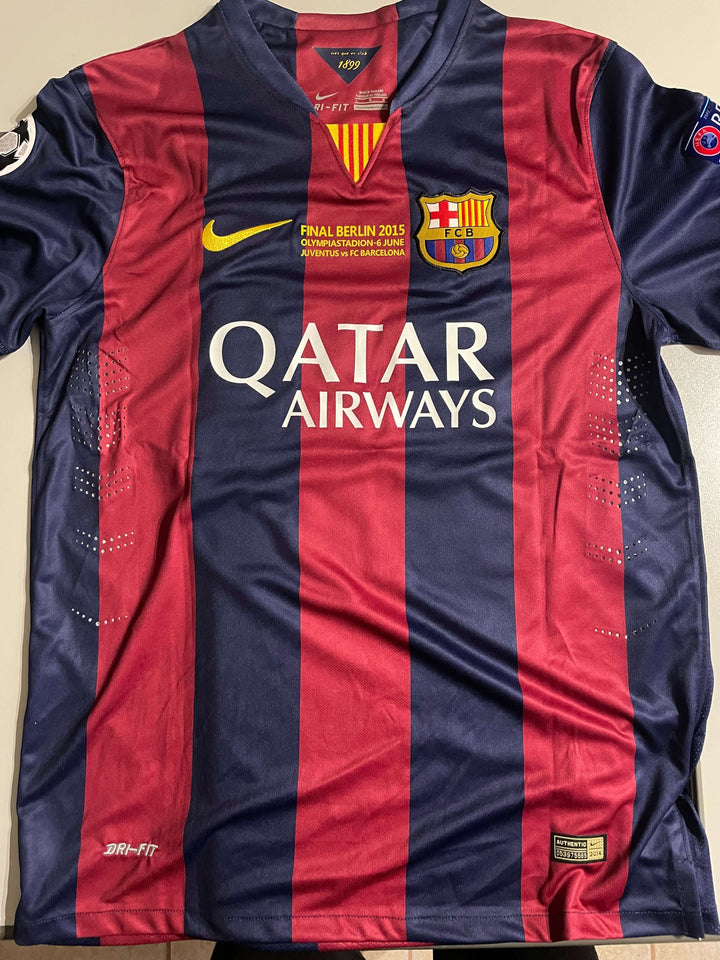 Lionel Messi signed FC Barcelona jersey from the 2015 Champions League Final, featuring distinctive colors and logos.