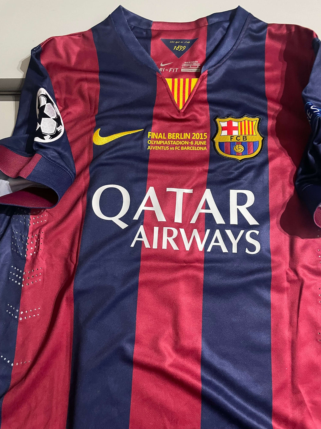 Lionel Messi signed 2015 Champions League final jersey from Barcelona, featuring team logo and sponsor Qatar Airways.