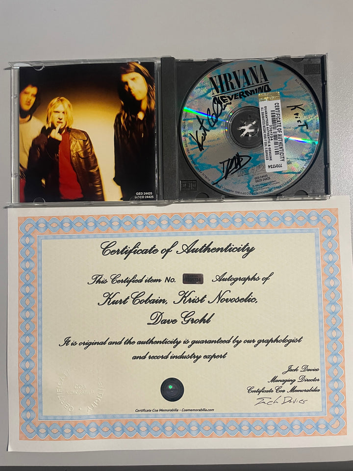 Nirvana - "Nevermind" CD 1991 - Autographed by Kurt Cobain, Dave Grohl, and Krist Novoselic + COA