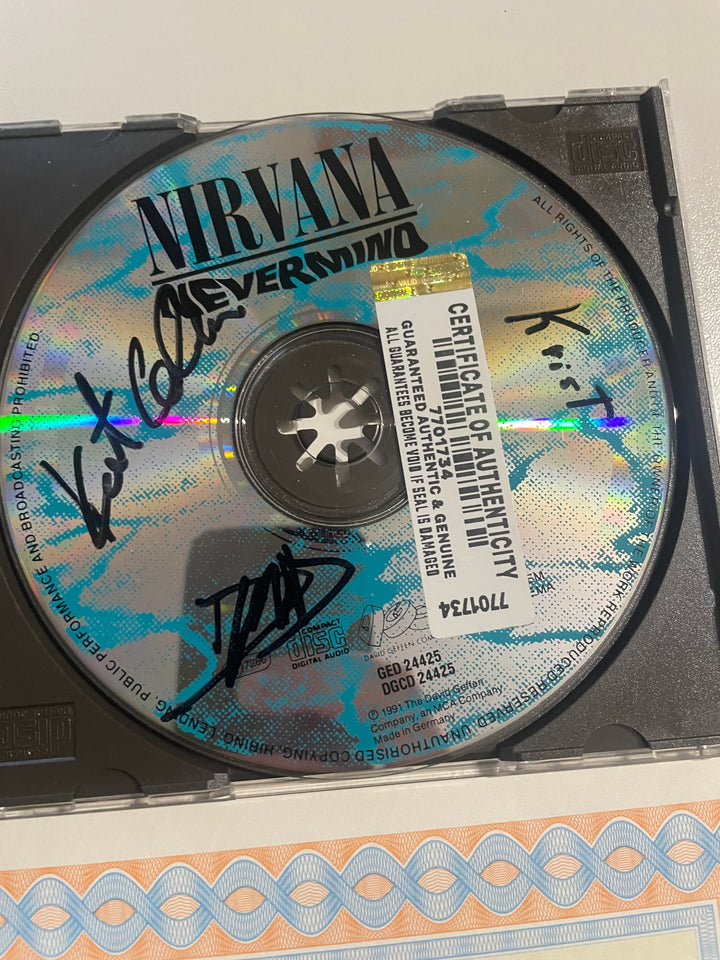 Nirvana - "Nevermind" CD 1991 - Autographed by Kurt Cobain, Dave Grohl, and Krist Novoselic + COA