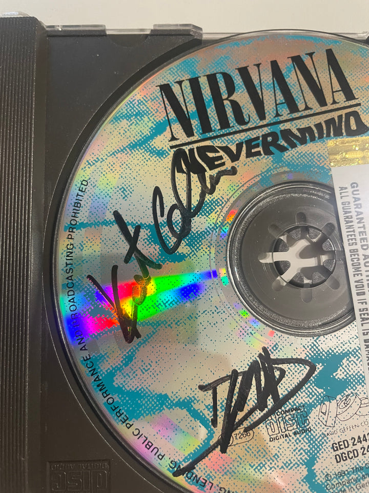 Nirvana - "Nevermind" CD 1991 - Autographed by Kurt Cobain, Dave Grohl, and Krist Novoselic + COA